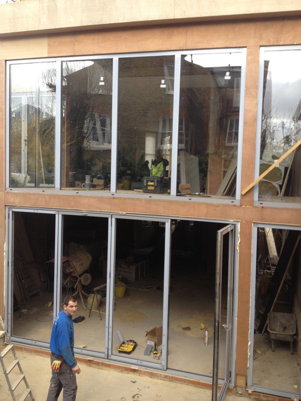 Aluminium bi-fold doors with two-storey glazing in Staines-upon-Thames